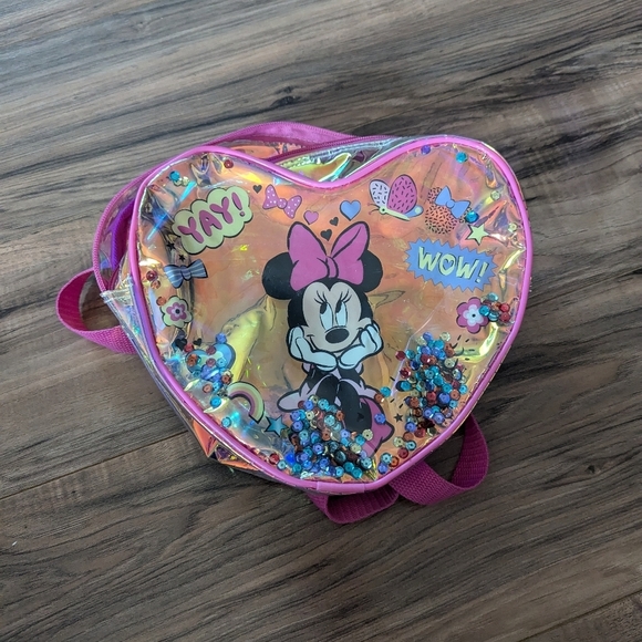 Minnie Mouse Plastic iridescent zipper close backpack with adjustable straps.